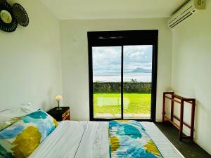 Postel nebo postele na pokoji v ubytování Villa Dabbadia, une vue unique et spectaculaire