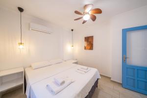a bedroom with a bed with two towels on it at Yoga House Kaş in Kaş