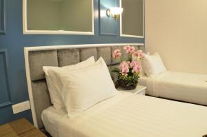 Postel nebo postele na pokoji v ubytování H Boutique Hotel Sri Petaling