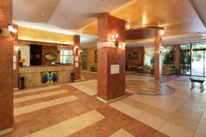 a large room with a lobby with a table at Yavor Palace Hotel - All Inclusive in Sunny Beach +10 photos
