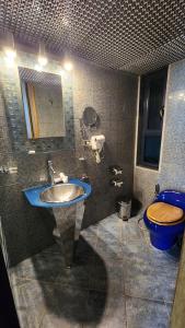 a bathroom with a sink and a toilet at Bay Lodge Boutique Hotel in Jounieh