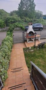 a brick walkway with a grill and a bench at Castelletto in Castello dʼAviano +41 photos