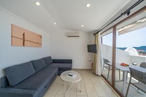 a living room with a couch and a table at Yoga House Kaş in Kaş