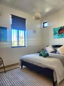 Ένα ή περισσότερα κρεβάτια σε δωμάτιο στο Agréable appart T4 avec Piscine à Pereybère. +29 φωτογραφίες