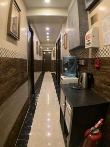 a kitchen with a counter top and a sink at 3D Inn Hong Kong - Dragon in Hong Kong