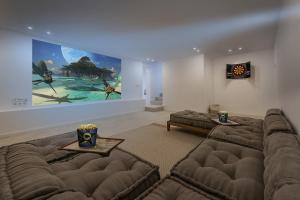 a living room with couches and a painting on the wall at Villa Bonjour in El Port