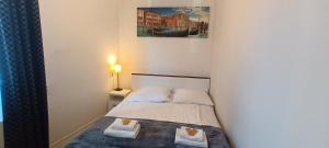 Posteľ alebo postele v izbe v ubytovaní Cracow Central Aparthotel