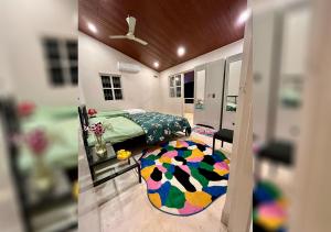 a bedroom with a bed and a colorful rug at Angel House -your private pet friendly haven in Lonavala +15 photos