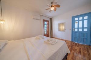a bedroom with a bed with two towels on it at Yoga House Kaş in Kaş