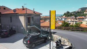 a car parked on the side of a street at Joyfül Accomodation in Finale Ligure