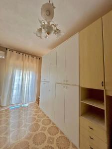 a room with white cabinets and a ceiling at Casa Tavano in Avola
