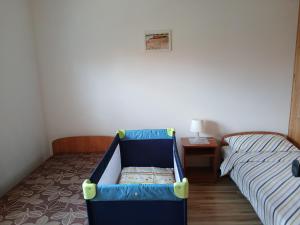 Postel nebo postele na pokoji v ubytování Apartamenty Jakob