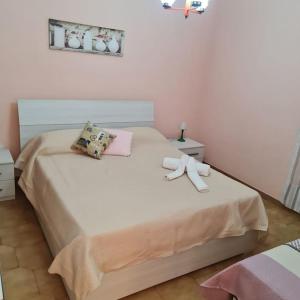 Ένα ή περισσότερα κρεβάτια σε δωμάτιο στο Atollo di Salve,alle Maldive del Salento Pescoluse