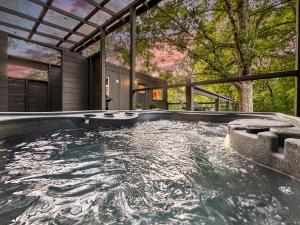 a swimming pool in the backyard of a house at Couples Retreat: King Bed:Hot tub:Firepit & More in Blue Ridge