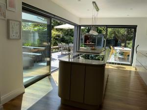 a kitchen with a island in the middle of a room at Frinton45 in Frinton-on-Sea