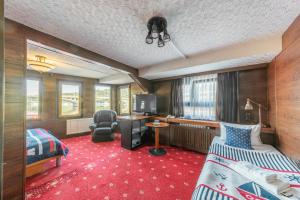 a hotel room with two beds and a desk at Botel Albatros in Prague
