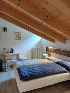 Postel nebo postele na pokoji v ubytování Casa Bresadola - Pellizzano