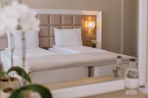 Ένα ή περισσότερα κρεβάτια σε δωμάτιο στο Impresamente Art Hotel