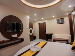 TV a/nebo společenská místnost v ubytování HOTEL RINKY'S PALACE