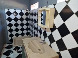Ένα μπάνιο στο Bungalow chez Mouch Nosy Be 1