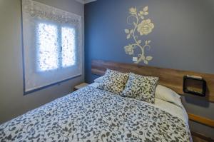 Posteľ alebo postele v izbe v ubytovaní Hostal La Pastora
