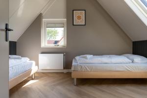 Postel nebo postele na pokoji v ubytování Hello Zeeland - Vakantiehuis Stern 260