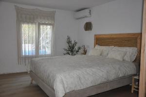 Postel nebo postele na pokoji v ubytování Casa Vive Tu Vida