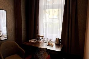 a desk in front of a window in a room at Relax in Duisburg +8 photos
