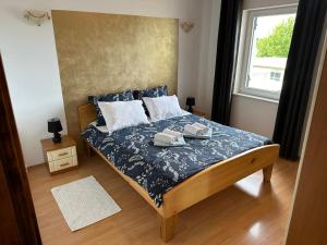 Posteľ alebo postele v izbe v ubytovaní Holiday Home Manuela