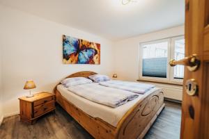 Un pat sau paturi într-o cameră la Ferienwohnung Gitte