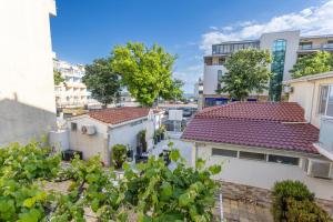 a view of the roofs of buildings in a city at Guest rooms and apartments Desi in Balchik