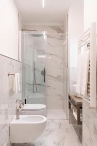 a bathroom with a shower and a toilet and a sink at Buenos Aires 58 in Milan +19 photos