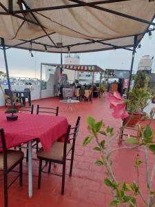 a patio with a table and chairs on a roof at Maison plaza in Arequipa