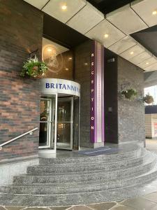 a building with stairs in front of a building at Britannia Inn Glasgow in Glasgow +82 photos