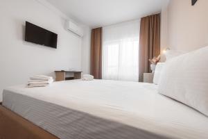Postel nebo postele na pokoji v ubytování Casa Polux + 19 fotografií