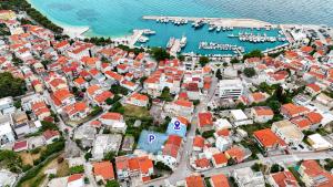 an aerial view of a city with a harbor at Wind Rose Rooms in Baška Voda