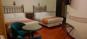 Llit o llits en una habitació de Hostal Colonial Potosi