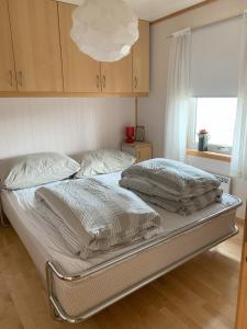 Postel nebo postele na pokoji v ubytování Voss Resort self-service apartments