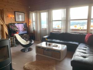 TV a/nebo společenská místnost v ubytování Voss Resort self-service apartments