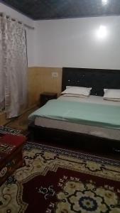 Postel nebo postele na pokoji v ubytování Julay Guest House