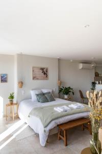 Rúm í herbergi á VUE 180°, superbe appartement cocooning !