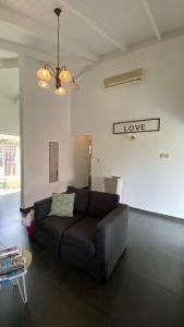 Khu vực ghế ngồi tại PURU AT JANTHIEL 8C - with pool, outdoor lounge and close to the beach