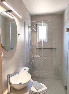 A bathroom at Angelica Studios and Apartments