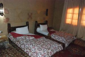 Hotel Taddart客房内的一张或多张床位