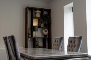 a dining room with a table and chairs at Victoria Apartments in Skegness