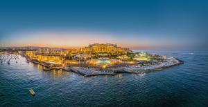 an aerial view of a resort on the ocean at Corinthia St George's Bay in St. Julianʼs