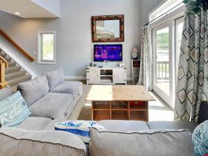 a living room with a couch and a table at Its 5 OClock Somewhere in McHenry