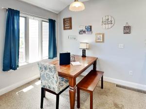 a home office with a wooden desk and a chair at Its 5 OClock Somewhere in McHenry +39 photos