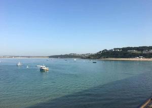a large body of water with boats in it at Stream Valley Holiday Park in Penzance