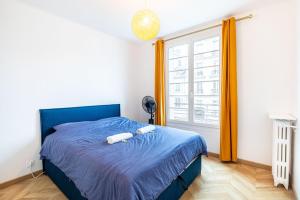 Säng eller sängar i ett rum på GuestReady - Estadia encantadora perto da Torre Montparnasse